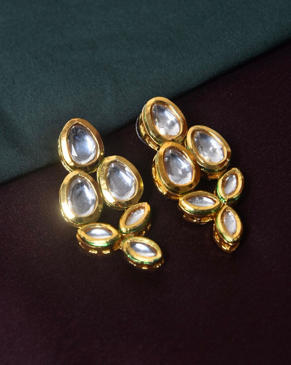 Gold-plated earrings with multiple teardrop-shaped clear stones.