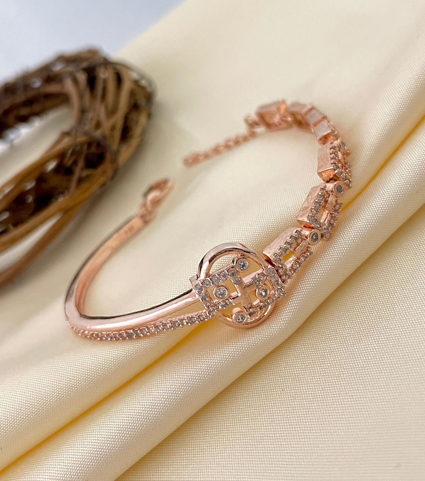 Rose gold bracelet with American diamonds and a flexible design for women.