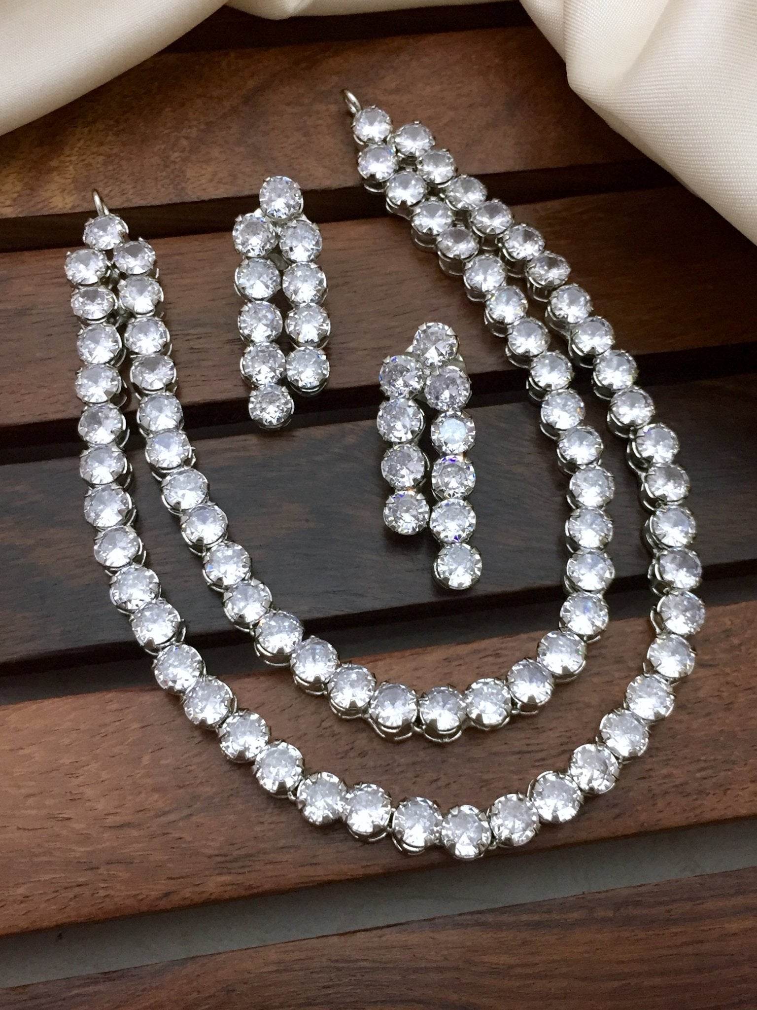 American diamond single stone necklace set with a pair of earrings.