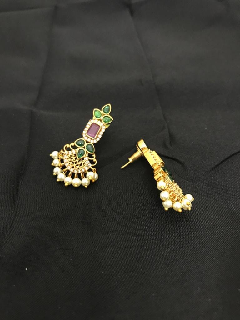 Gold earrings with green and pink gemstones, adorned with pearl dangles.