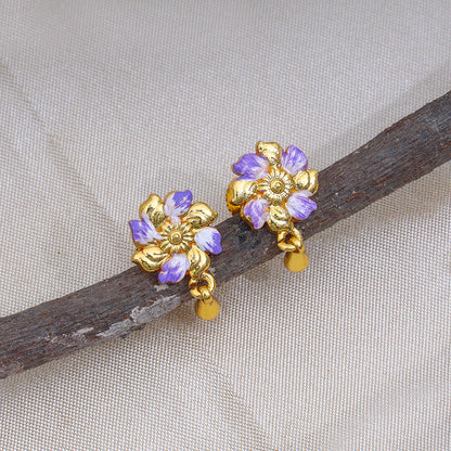 Elegant Floral and Peacock Jhumka Earrings with Purple and Teal Accents