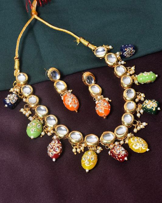 A colorful beaded necklace with matching earrings featuring intricate designs and gemstones.