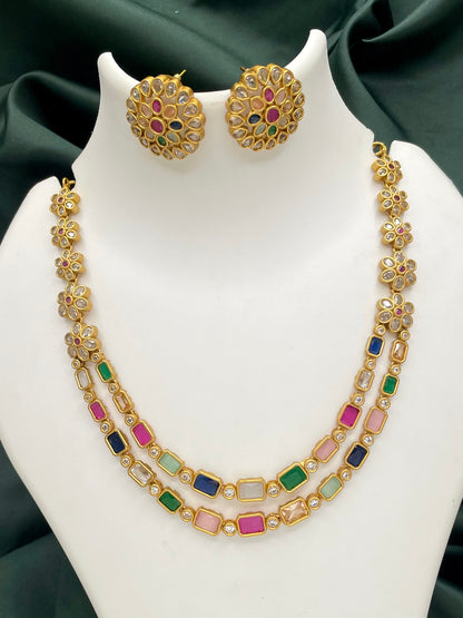 Gold necklace with multicolored gemstones and matching round earrings.